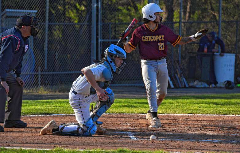 Northampton catcher Matthew Baird knocks down a pitch in the dirt while Chicopee’s Xavion Maldonado tells a runner to stay put the Blue Devils’ 15-14 loss on Monday in Northampton.