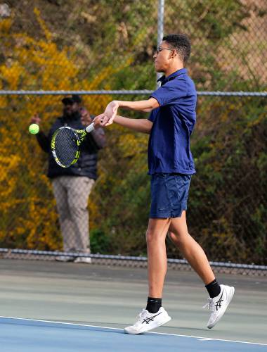 Northampton’s Durrell Patrick volleys against Amherst’s Elias Katsaros during their No. 2 singles match Wednesday in Amherst.