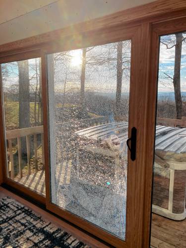 On March 29, a bullet hit this sliding glass door in the back of a Belchertown home, which led to an investigation by the district attonery’s office.