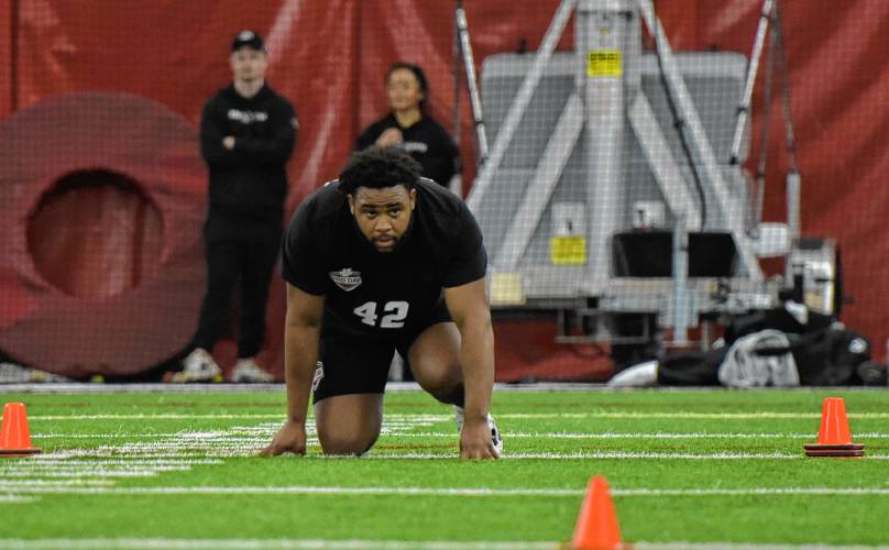 Billy Wooden sets up and prepares to run the 40-yard dash during UMass’ Pro Day on Tuesday afternoon in Amherst.