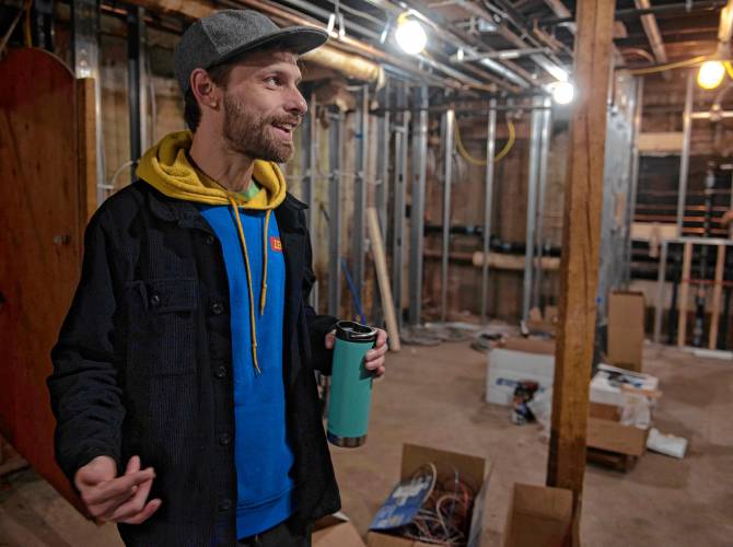 Chris Freeman, executive director of The Parlor Room Collective, talks in early March about the renovation of the Iron Horse; he’s standing in the expanded and revamped green room for artists.