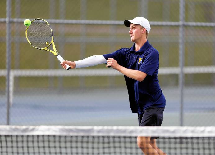 Northampton’s Reilly Fowles returns a shot against Amherst’s Miles Jeffries during their No. 1 singles match Wednesday in Amherst.