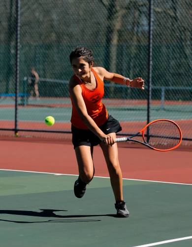 South Hadley’s Estella Estrada eyes the ball in for a backhand against Belchertown’s Ava Shea during their No. 1 singles match Thursday at Mount Holyoke College.