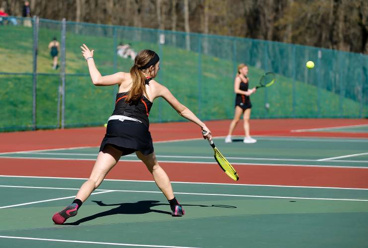 Belchertown’s Ava Shea lunges for a backhand shot against South Hadley’s Estella Estrada during their No. 1 singles match Thursday at Mount Holyoke College.