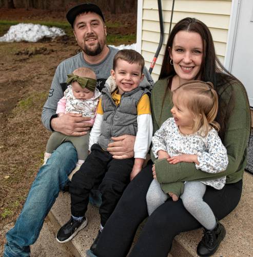 Ian Goudreau and Kellyann Kaiser with their three children, Avaree Goudreau, 3 months, Landon Goudreau, 3, and Bailee Goudreau, 2, at Kaiser’s home in Ware. 