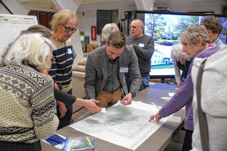 Deerfield Planning & Economic Development Coordinator Christopher Dunne talks to residents during the town’s senior housing open house on Thursday evening at Town Hall.