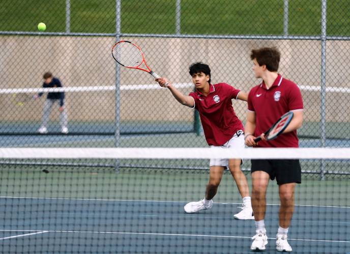 Amherst’s Talvin Dhingra and Alexander Probezinsky compete against Northampton’s Kaz Sugihara and Oliver Levine during their No. 1 doubles match on Wednesday in Amherst.