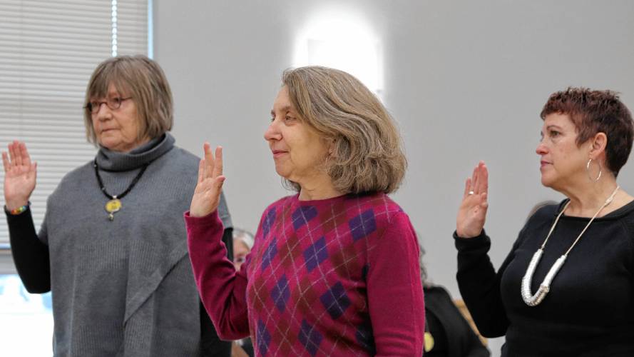 From left, Northampton School Committee members Gwen Agna, Aline Davis and Kerry LaBounty are sworn in Tuesday.