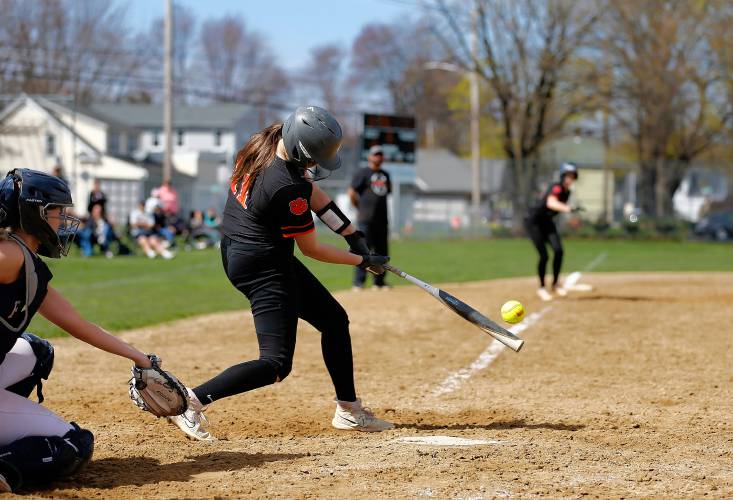 South Hadley’s Grace Matyszewski (11) hits an RBI single to tie the game in the bottom of the sixth inning against Frontier on Friday in South Hadley.