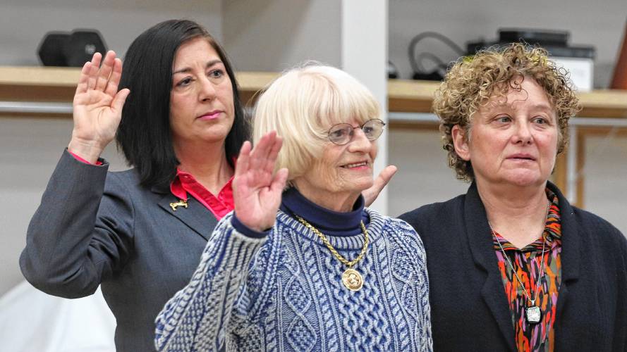 From left, city councilors Rachel Maiore, Marianne LaBarge and Deborah Pastrich-Klemer are sworn in during an inauguration ceremony held at the Northampton Senior Center on Tuesday.