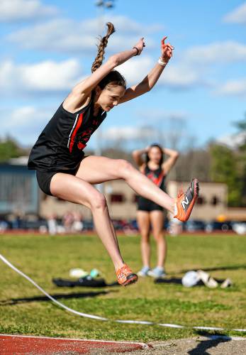 Belchertown’s Mackenzie Burch competes in the long jump Tuesday during their meet against Easthampton at Mountain View School in Easthampton.