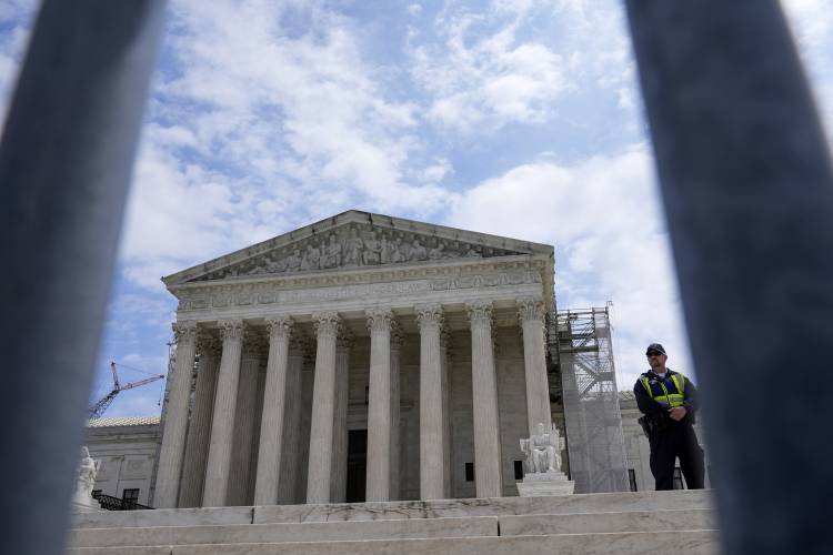 The Supreme Court is seen during a protest as the justices prepare to hear arguments over whether Donald Trump is immune from prosecution in a case charging him with plotting to overturn the results of the 2020 presidential election, on Capitol Hill Thursday, April 25, 2024, in Washington. (AP Photo/Mariam Zuhaib)
