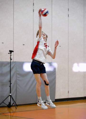 Frontier’s Aleks Carey (18) serves against Belchertown in the third set Tuesday in Belchertown.