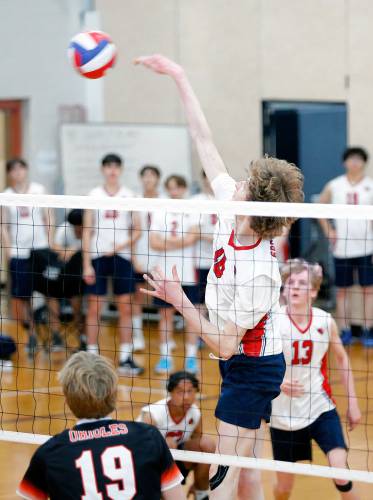 Frontier’s Aleks Carey (18) registers a kill against Belchertown in the first set Tuesday in Belchertown.