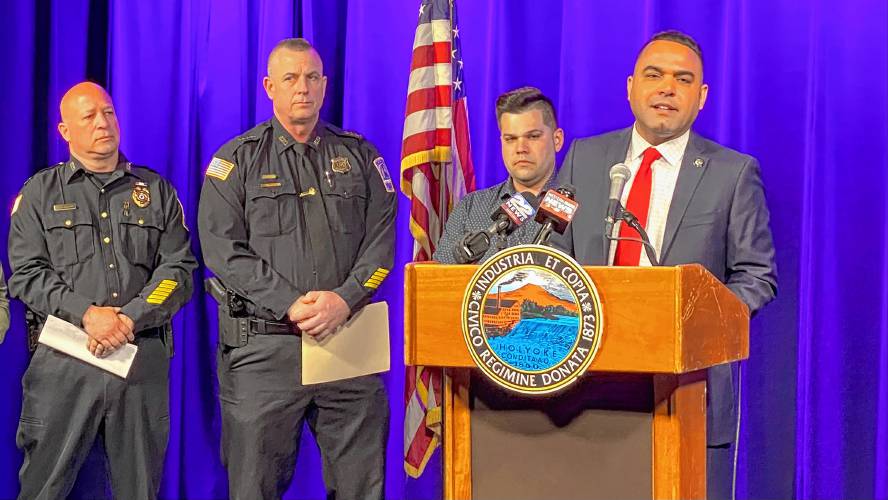 From right, Holyoke Mayor Josh Garcia speaks while Holyoke Police Chief David Pratt and Captain Isaias Cruz look on. Pratt announced his retirement as police chief during the conference held on Friday, while Cruz will take over as interim chief. 