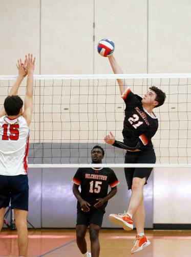 Belchertown’s Brian Burns (21) attacks at the net against Frontier in the second set Tuesday in Belchertown.