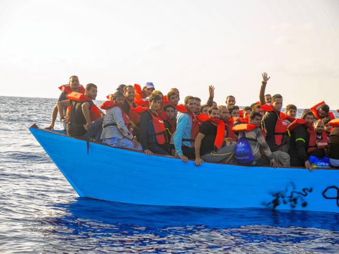 Migrants hoping to make it to Italy are rescued from the sea some 30 miles off Libya by the members of the humanitarian ship Geo Barents on Oct. 6. Political and economic forces roiled by climate change are fueling a growing tide of migration around the globe.