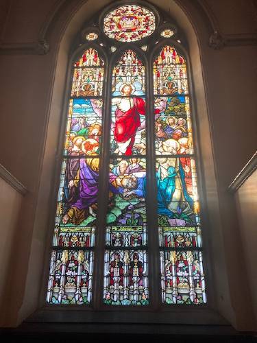 A stained glass window at the shuttered St. Mary of the Assumption Church in Northampton. The diocese has asked the court permission to remove five such windows after the issue issued a stop-work order citing historic preservation rules.  