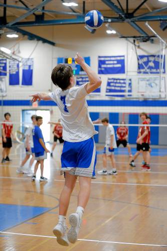 Granby’s Jake Gagnon (7) serves an ace against Athol in the first set Wednesday in Granby.