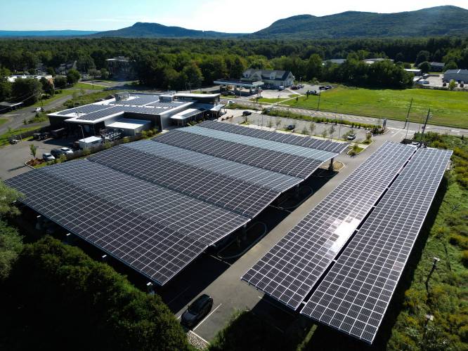 Solar panels at River Valley Co-op in Easthampton. A  report from Mass Audubon and Harvard Forest is recommending ways to protect prime forest and farm land while accommodating solar development, in part by encouraging more solar on the built environment, such as over parking lots. 