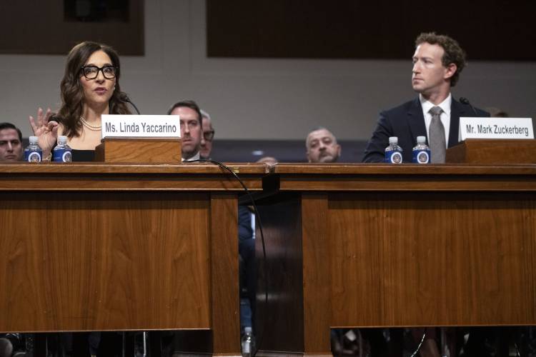 X CEO Linda Yaccarino, left, speaks as Meta CEO Mark Zuckerberg, right, listens during a Senate Judiciary Committee hearing on Capitol Hill in Washington, Wednesday, Jan. 31, 2024, on child safety. (AP Photo/Mark Schiefelbein)