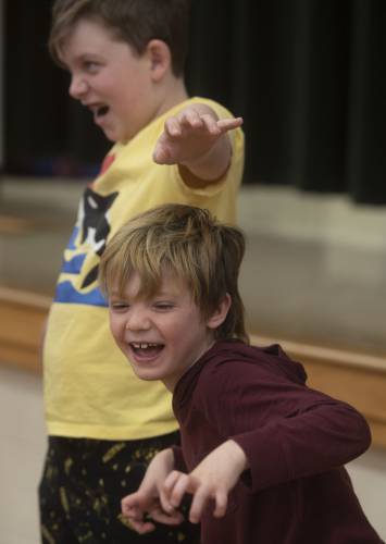 Boe Jackson acts like a Lion with, left, Lucca Rodney-Gage during the culmination of an improvisation work shop taught by Jonathan Mirin, of the Piti Theatre Company, at the New Hingham Elementary School in Chesterfield.