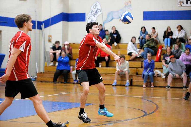 Athol’s Colin Mason (11) passes against Granby  in the second set Wednesday in Granby.