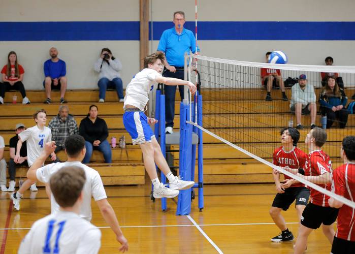 Granby’s Jake Gagnon (7) attacks at the net against Athol in the first set Wednesday in Granby.