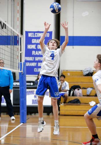 Granby’s Braeden Gallagher (4) sets the ball against Athol in the second set Wednesday in Granby.