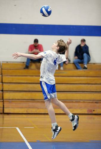 Granby’s Braeden Gallagher (4) serves against Athol in the second set Wednesday in Granby.