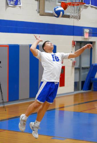 Granby’s Michael Swanigan (10) serves against Athol in the first set Wednesday in Granby.