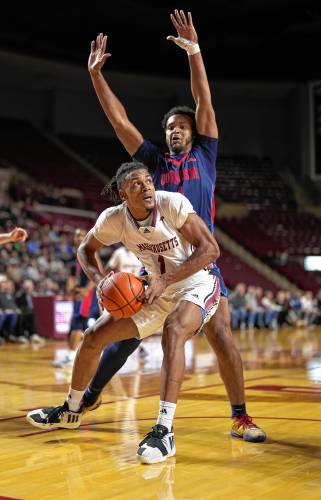 UMass’ Daniel Hankins-Sanford (1) goes to the basket during action last week against Duquesne. The Minutemen host La Salle on Wednesday night at the Mullins Center.