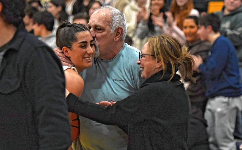 Northampton’s Ava Azzaro (center) scored the 1,000th point of her career against Wahconah on Monday night in Northampton.