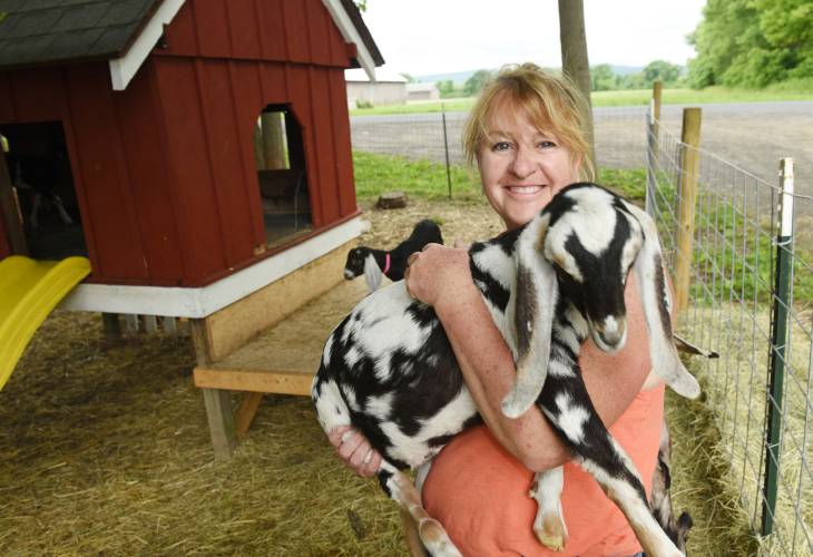 Laurie Cuevas with her goats at the Thomas Farm and Dairy in Sunderland. Cuevas will be one of three guest speakers at Saturday’s Pioneer Valley Regional Agricultural Conference to take place at Smith Vocational and Agricultural High School in Northampton. 