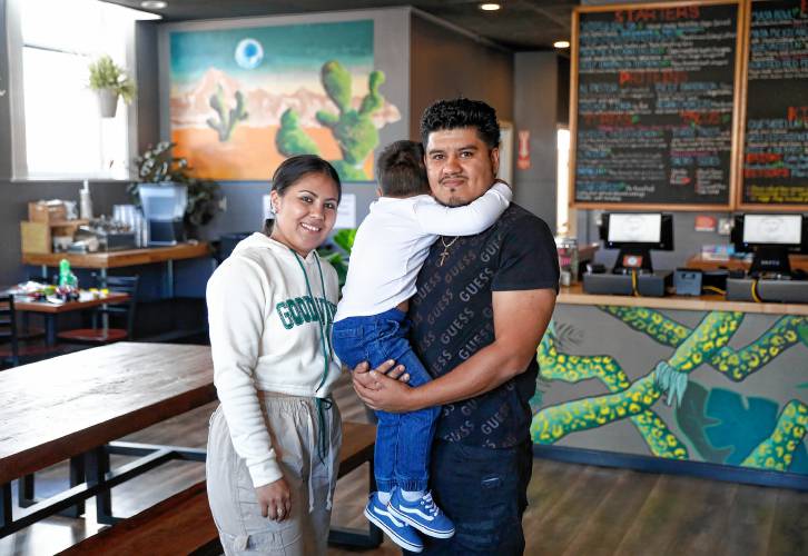Masa Mexicano owner Roberto Saravia, right, his wife Maria Carolina Arias and son Jancarlos, 3, at the restaurant Thursday afternoon in Florence.