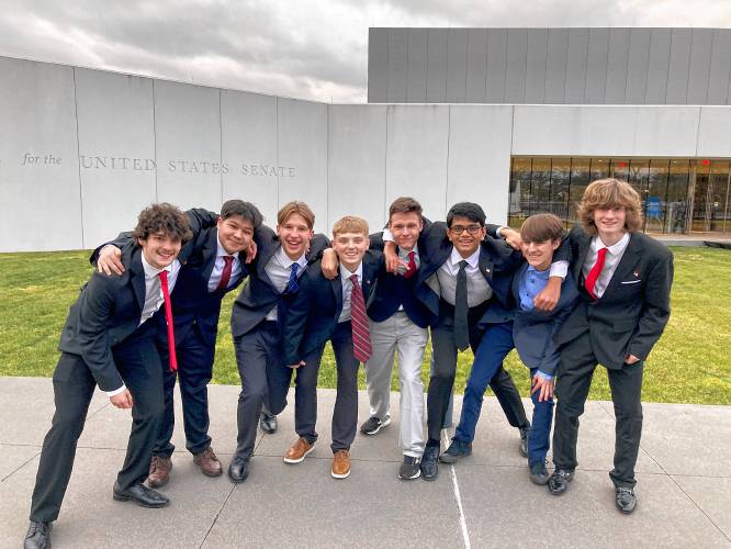 Members of the Easthampton High School’s We the People team pause for a photo outside of the EMK Center where the competition took place. From left are Chris Gallagher, Jintha Kim, Sam Barr, Ethan Mullaly, Roman Powers-Moran, Yug Patel, Jackson Scott and Finn Garvey.