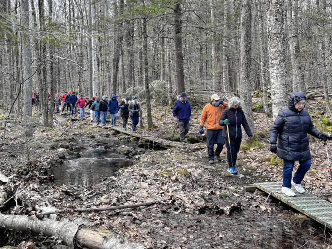 People take part in a New Year’s Day hike at Briar Hill in Williamsburg.