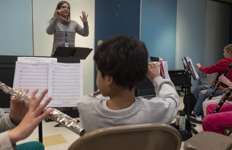 Ariel Templeton, a music teacher for the Amherst elementary schools, teaches band at Wildwood Elementary School on Feb. 14.