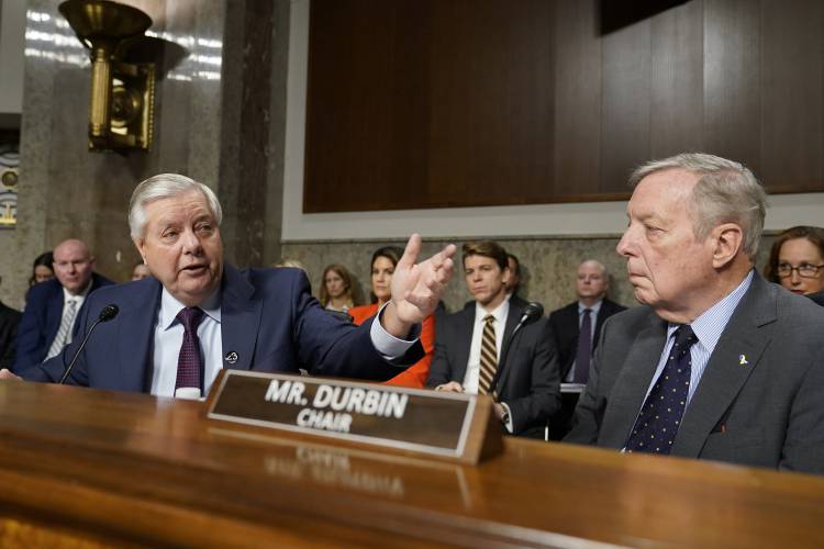 Senate Judiciary Committee Chairman Sen. Dick Durbin, D-Ill., right, listens as ranking member Sen. Lindsey Graham, R-S.C., left, speaks during a hearing with the heads of social media platforms on Capitol Hill in Washington, Wednesday, Jan. 31, 2024, to discuss child safety. (AP Photo/Susan Walsh)