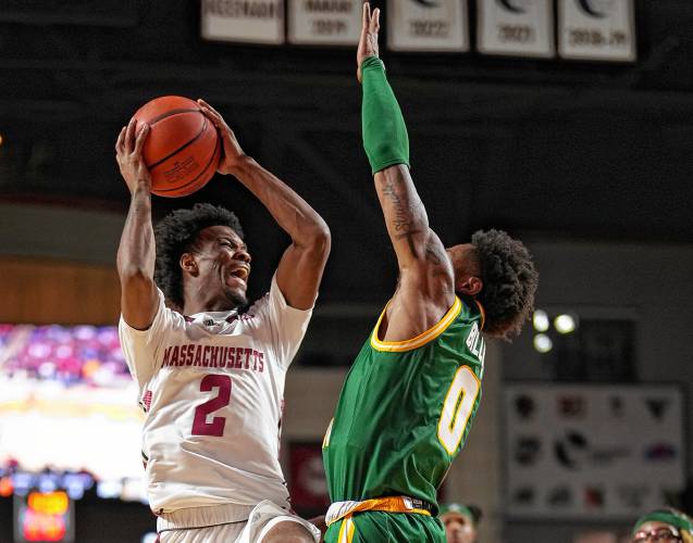 UMass freshman Jaylen Curry (2) goes to the basket during the Minutemen’s 66-65 victory over George Mason on Saturday afternoon at the Mullins Center in Amherst.