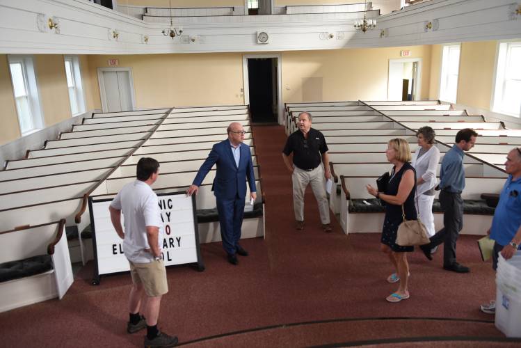U.S. Rep Jim McGovern, second from the left, tours the former South Deerfield Congregational Church in July 2022. Despite the South County Senior Center’s three member towns having received a $75,000 grant in December 2022 to conduct a feasibility study on the church to see if it could serve as the center’s long-term home, a study has yet to be conducted as the grant’s expiration date approaches this summer.