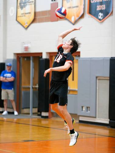 Belchertown’s (18) serves against Frontier in the third set Tuesday in Belchertown.